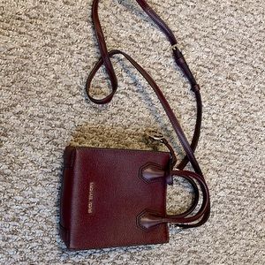 Michael Kors burgundy small cross body.